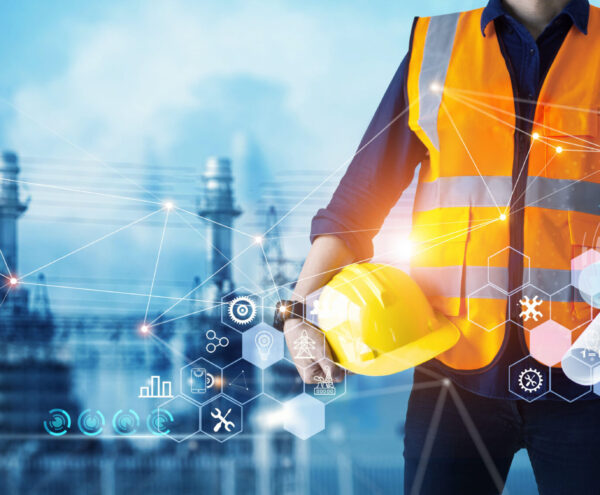 Male industrial, Electrical engineer with helmet and blueprints in hands checking, maintenance, and analysis data of power plant station project on substation and network background. analise de qualidade energia